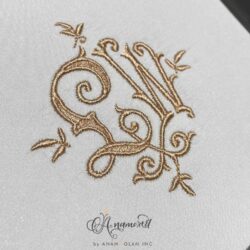 LW Monza Embroidery monogram design, sewout on grey fabric in tan thread