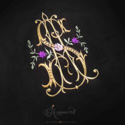A and S interlocking embroidery monogram with flowers and vines on black background in gold thread and purple flowers