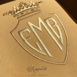 Shield Embroidery Monogram Font sewn in gold thread shades on gold fabric, letters E, M, B