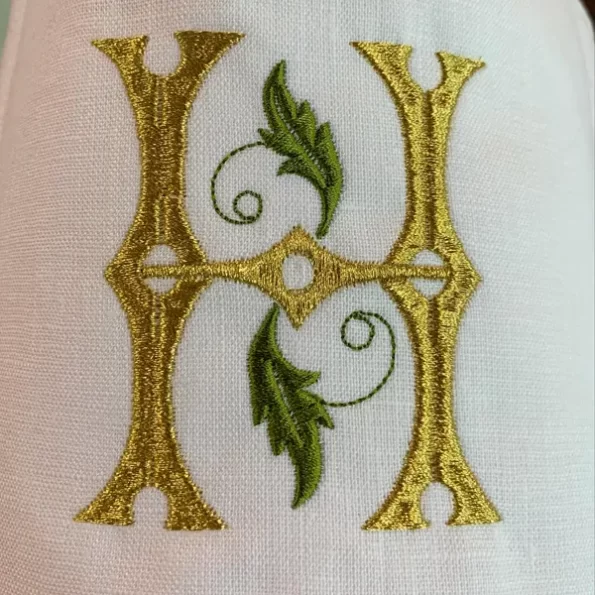 Secret Garden in gold thread with green foliage